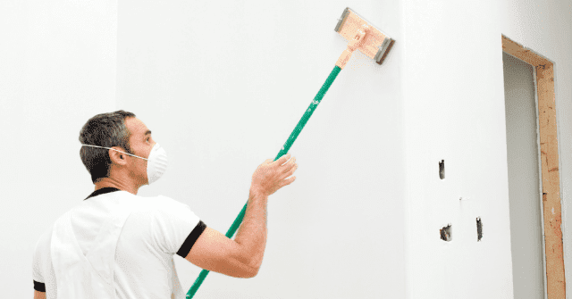 Man doing drywall repairs
